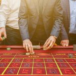 bigstock Group Of People Behind Roulett 323735470